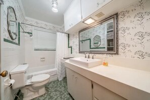 Combined shower/bathtub, hair dryer, towels, soap