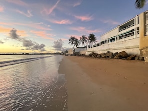 On the beach, sun loungers, beach towels - Guest Favorite • “True Oceanfront” Luquillo Condo • Walk to Kioskos & El Yunque (Playa Fortuna)