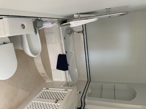 Separate bathtub and shower, deep-soaking bathtub, hair dryer, towels