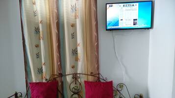 1 bedroom, desk, iron/ironing board, travel crib