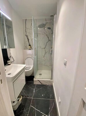 Shower, hair dryer, towels, soap