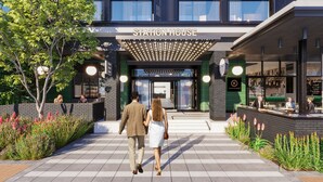 A modern building with a sign reading "Station House" and a glass entrance. - Home Suite Hotels Station House (Cape Town)