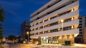 A modern hotel with multiple floors, a well-lit entrance, and a visible reception area. - Hedera Estate, Hedera A15 (Dubrovnik)