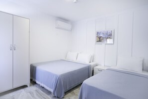 Basic-Dreibettzimmer | Zimmersafe, schallisolierte Zimmer, Bettwäsche