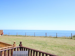 A wooden deck with a view of the ocean. - 121 (Lowestoft)