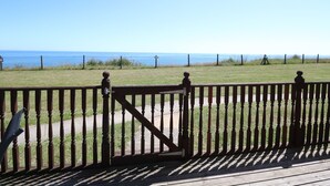 A wooden deck with a view of the ocean. - 121 (Lowestoft)