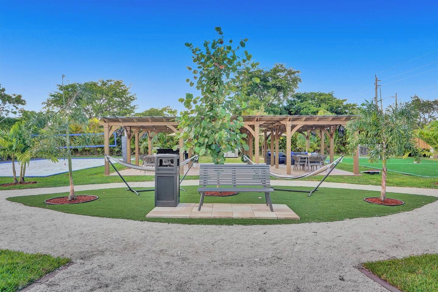 A park with a gazebo, a bench, and a hammock.