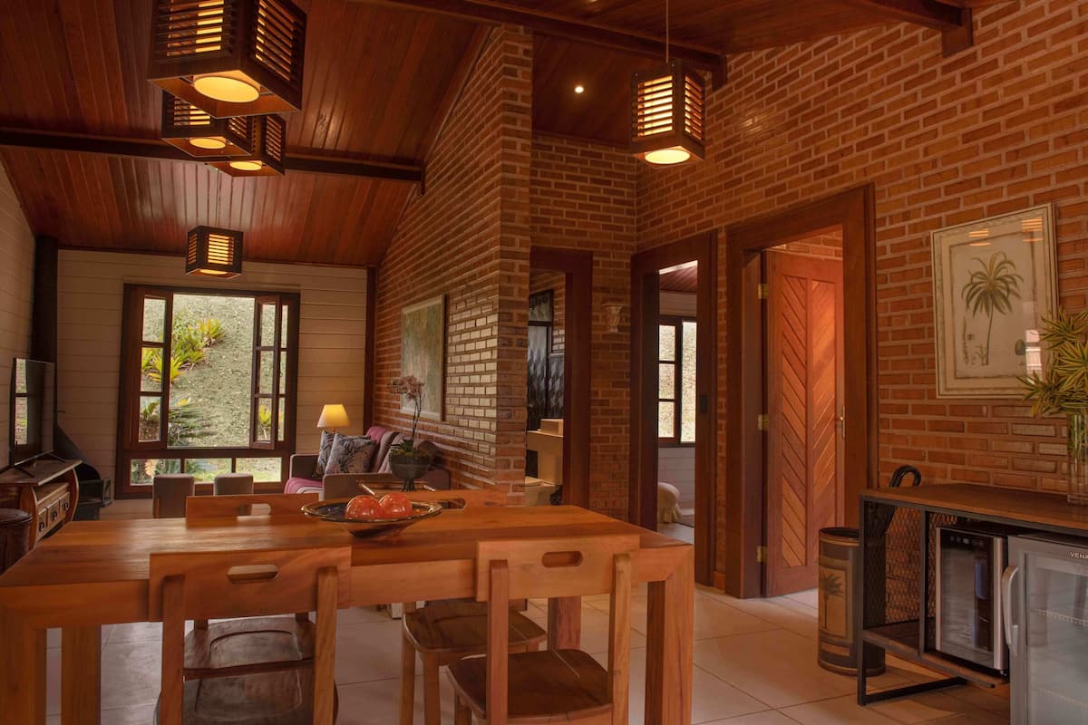 Deluxe Cabin, 1 Bedroom, Mountain View, Garden Area | Living area | 50-inch Smart TV with satellite channels, TV, fireplace