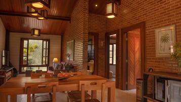 Deluxe Cabin, 1 Bedroom, Mountain View, Garden Area | Living area | 50-inch Smart TV with satellite channels, TV, fireplace