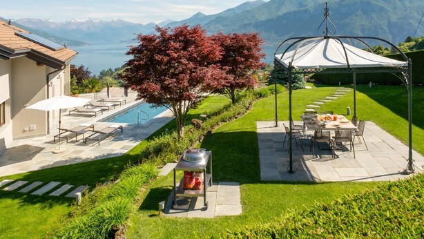 A pool area with a pergola, outdoor seating, and a view of mountains. - Villa Sonni - Four Bedroom Villa, Sleeps 8 (Bellagio)