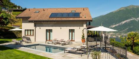 A heated pool, pool loungers