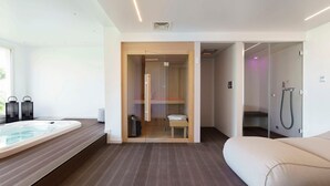 A modern bathroom with a large bathtub, a glass-enclosed shower area, and a wooden bench. - Villa Suprema - Four Bedroom Villa, Sleeps 8 (Pirato)