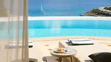 An infinity pool, sun loungers