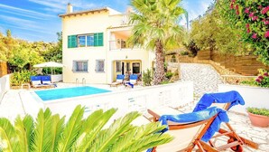 A two-story house with a swimming pool, outdoor seating, and lush greenery. - Villa Mellow - Three Bedroom Villa, Sleeps 6 (Ionian Islands)