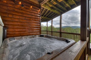 A hot tub in a wooden cabin with a view of mountains. - Casa Con Vista | Mtn Views + Hot Tub + Game Room (Epworth)