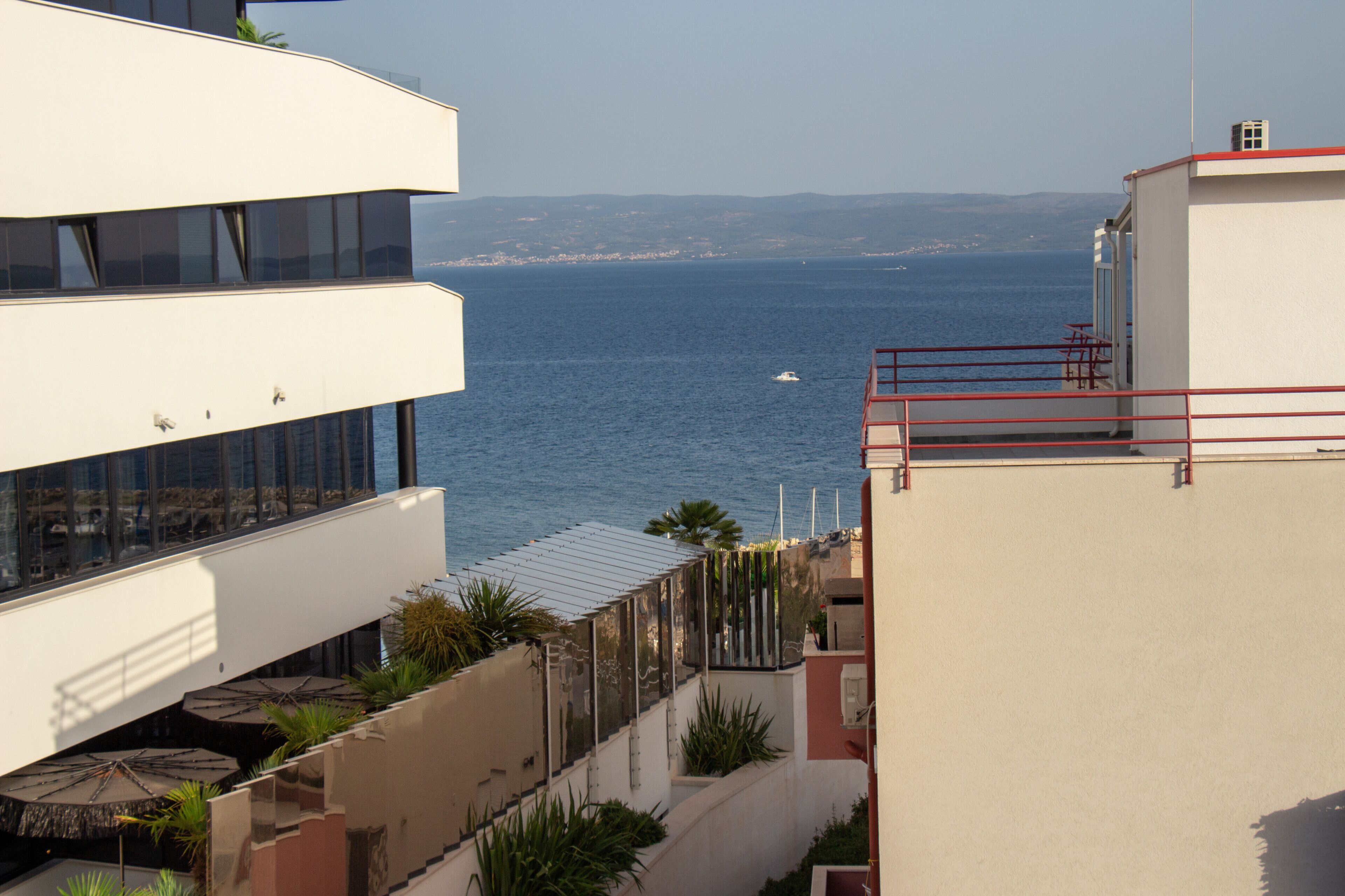 A modern building with a view of the sea.