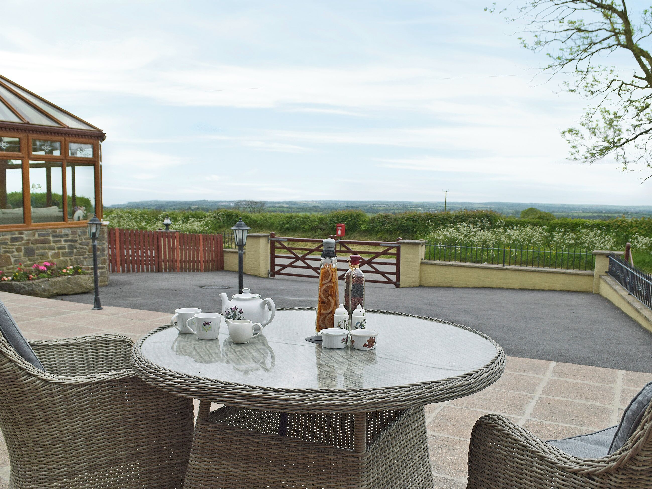 Relaxing sitting-out-area with lovely views | Hayloft Cottage - Croft Farm Cottages, Ludchurch, near Narberth