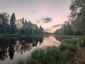 Escape to a serene lakeside haven surrounded by dense forests.