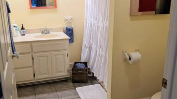 Combined shower/tub, hair dryer, towels, soap