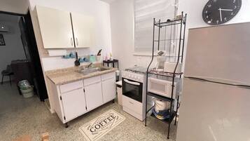 Fridge, microwave, stovetop, coffee/tea maker