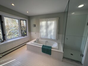 Combined shower/tub, towels, soap, shampoo