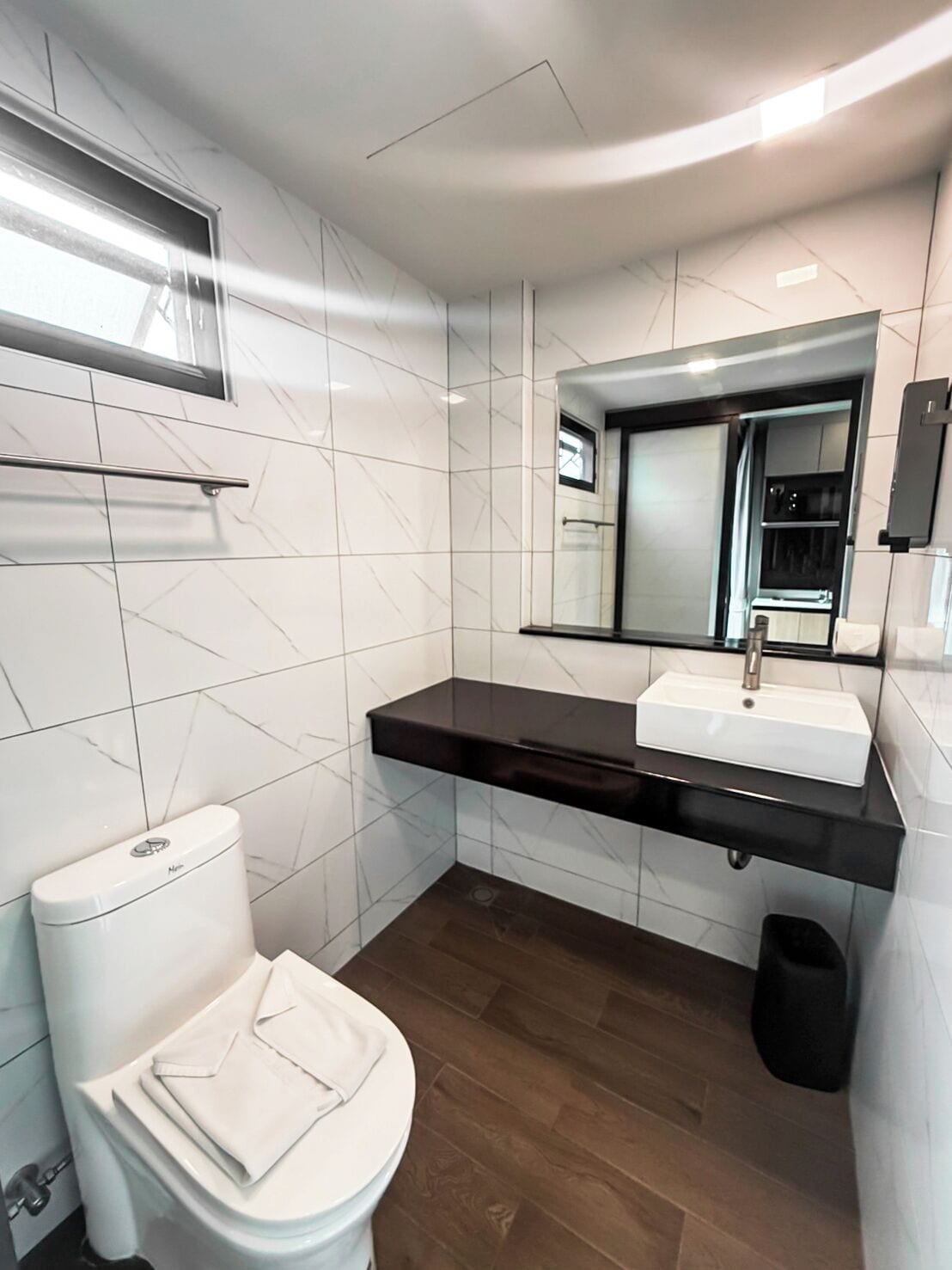 shower, rainfall showerhead, hair dryer, towels