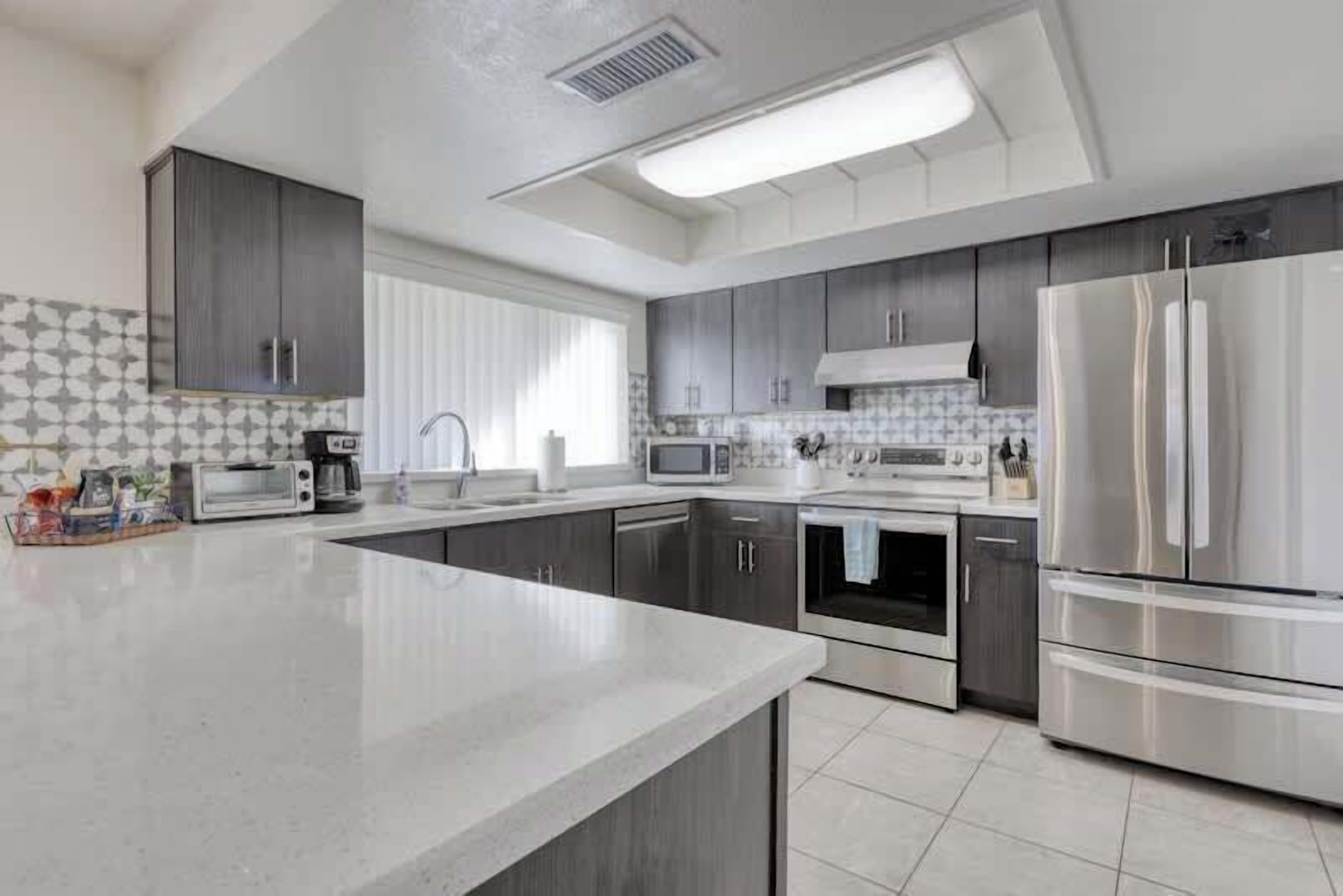 Full-size fridge, coffee/tea maker, highchair, toaster oven