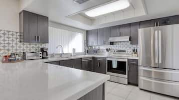 Full-size fridge, coffee/tea maker, highchair, toaster oven