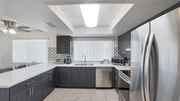 Full-size fridge, coffee/tea maker, highchair, toaster oven