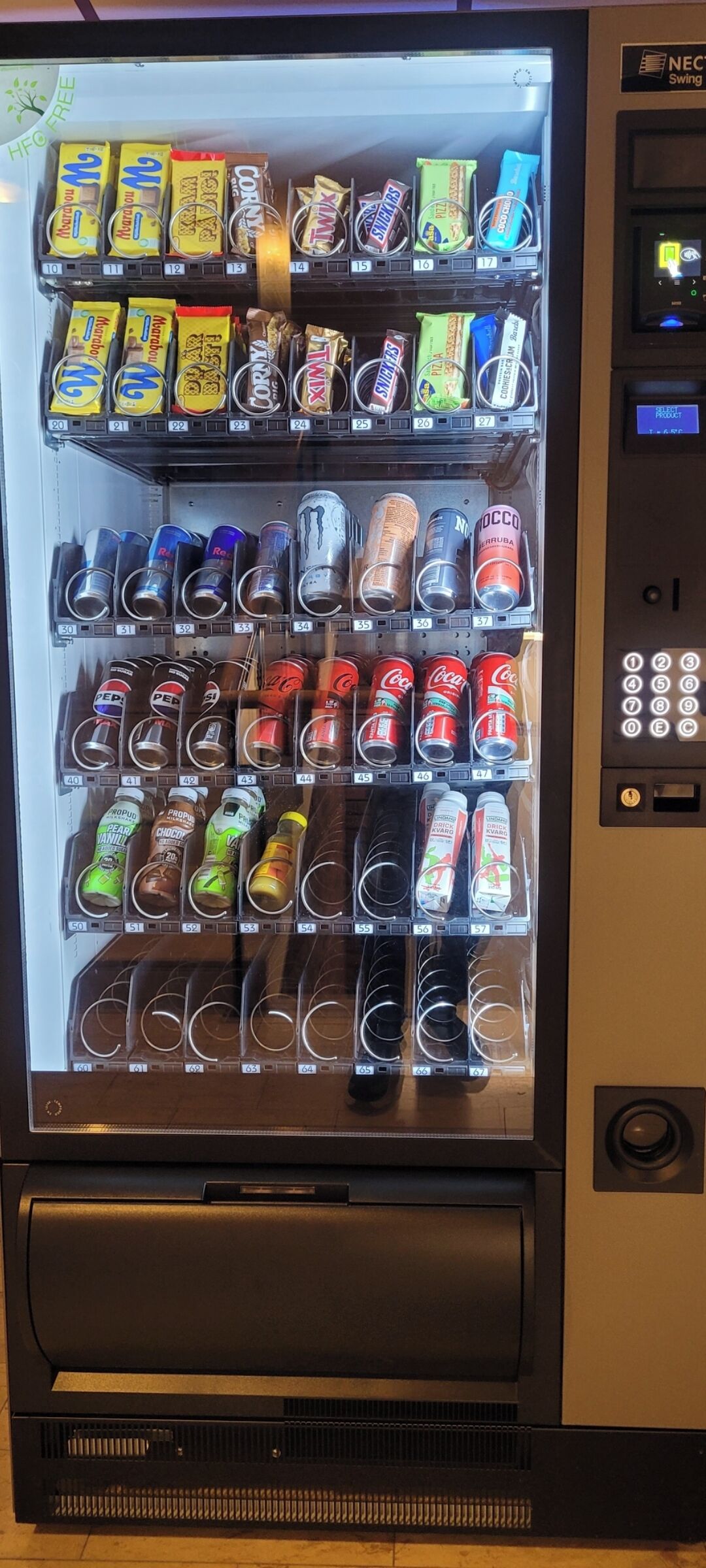A vending machine with various snacks and drinks.