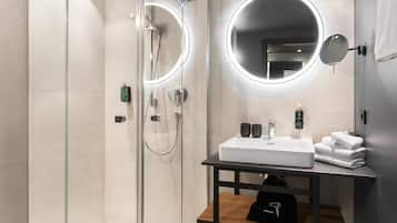Shower, designer toiletries, hair dryer, bathrobes
