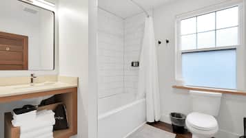 Shower, hair dryer, towels, shampoo