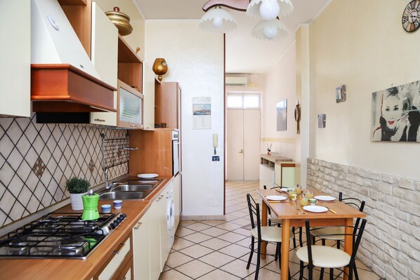 Fridge, oven, electric kettle, cookware/dishes/utensils
