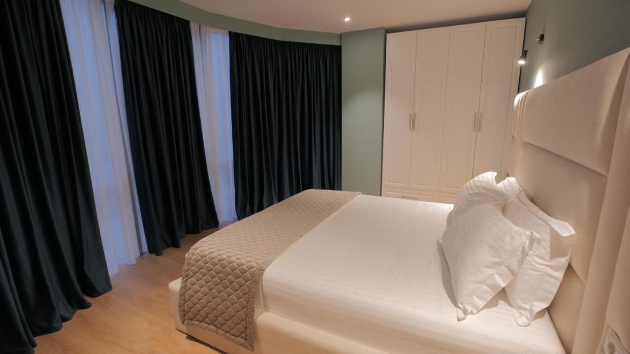 family room, city view | 1 bedroom, minibar, desk, free wifi