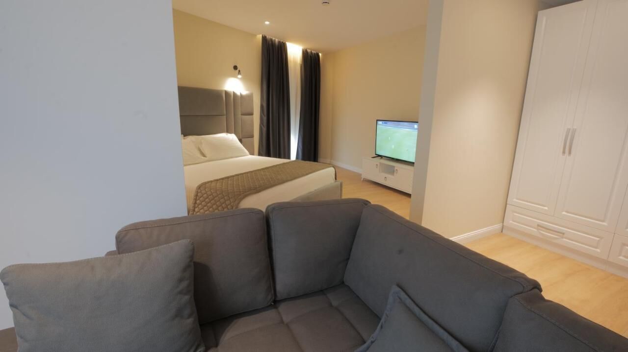 family room, city view | 1 bedroom, minibar, desk, free wifi