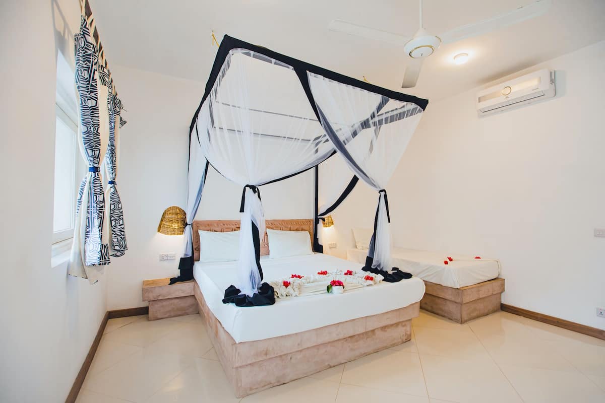 Classic Room, 1 Bedroom, Pool View, Beachside | Minibar, in-room safe, desk, free WiFi