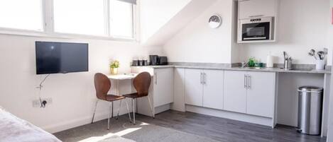 Fridge, microwave, stovetop, coffee/tea maker