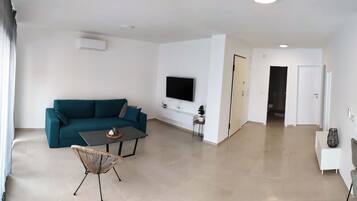 Apartment, Mehrere Betten | Wohnzimmer