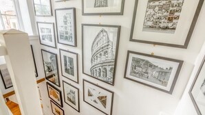 A wall with framed black and white photographs of various architectural structures and scenes. - 2 Bed in Branscombe (oc-mbhave) (Branscombe)