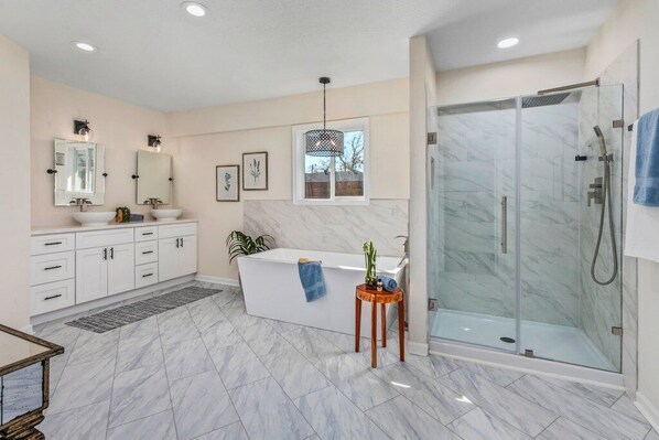 Bathtub, hair dryer, towels, soap - New-Bright-Stylish-City Center 4 Bedroom 3 Bath Home with Office (Lake Charles)