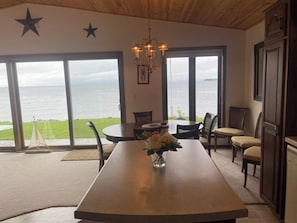 Enjoy meals in this elegant dining area with a large table and comfortable seating for all.