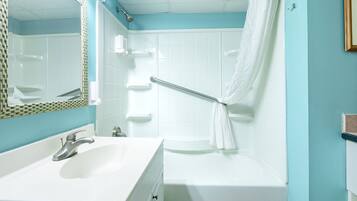 Combined shower/bathtub, towels, toilet paper