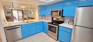 Condo, Multiple Beds, Balcony | Private kitchen | Fridge, microwave, oven, stovetop