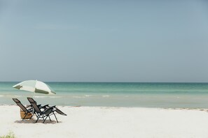 Beach nearby, white sand, sun loungers, beach umbrellas