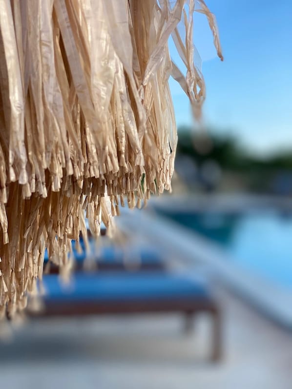 A close-up of a poolside area with a blurred background.