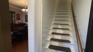 A staircase with a handrail and a landing area. - Minutes from Churchill Downs & Downtown Lou! (Louisville)