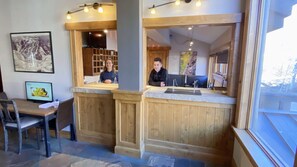 Reception area with a welcoming atmosphere, featuring a reception desk and comfortable seating for guests.