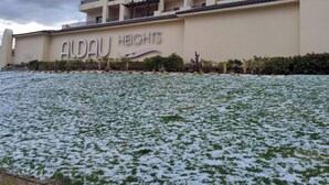 A multi-story hotel named 'Aldau Heights' with a large sign on the building. - luxury apartments in aldau heights with two pools 11514 (Hurghada)