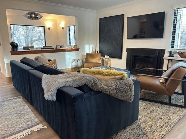 Smart TV, fireplace, books, printers