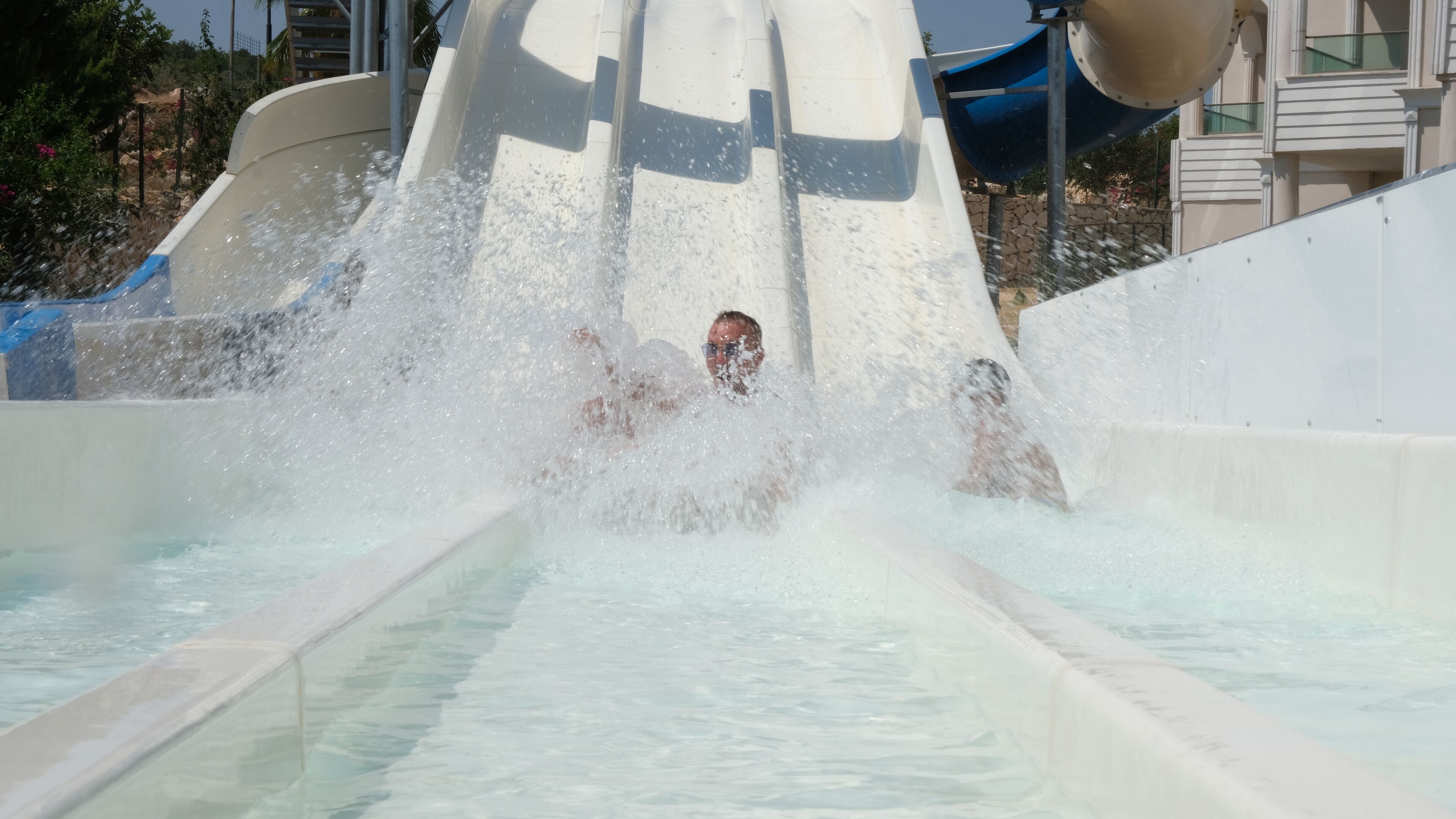 A water slide with a person sliding down.